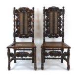 A pair of Charles II and later oak and bergere hall chairs with crown finial's,