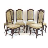 A set of six 17th century and later Dutch oak dining chairs with shaped aprons,