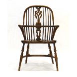 A 20th century lowback Windsor armchair with a pierced splat,