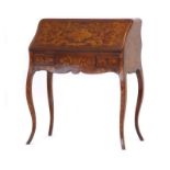 A 19th century Dutch marquetry bonheur de jour, the fall front enclosing a fitted interior,