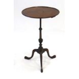 A late 19th century mahogany wine table, the circular top with satinwood inlay,