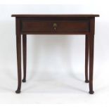 An 18th century oak lowboy with a single frieze drawer on circular tapering legs with pad feet, w.