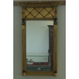 A Georgian-style giltwood and ebonised wall mirror,