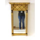 A Georgian-style giltwood and ebonised wall mirror,