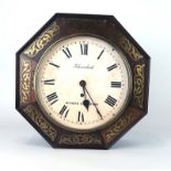 A 19th century octagonal wall-clock, the face with Roman numerals, Fehrenback Bishops Stortford,