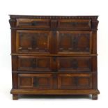 A Charles II and later oak chest of four drawers on block feet, w.