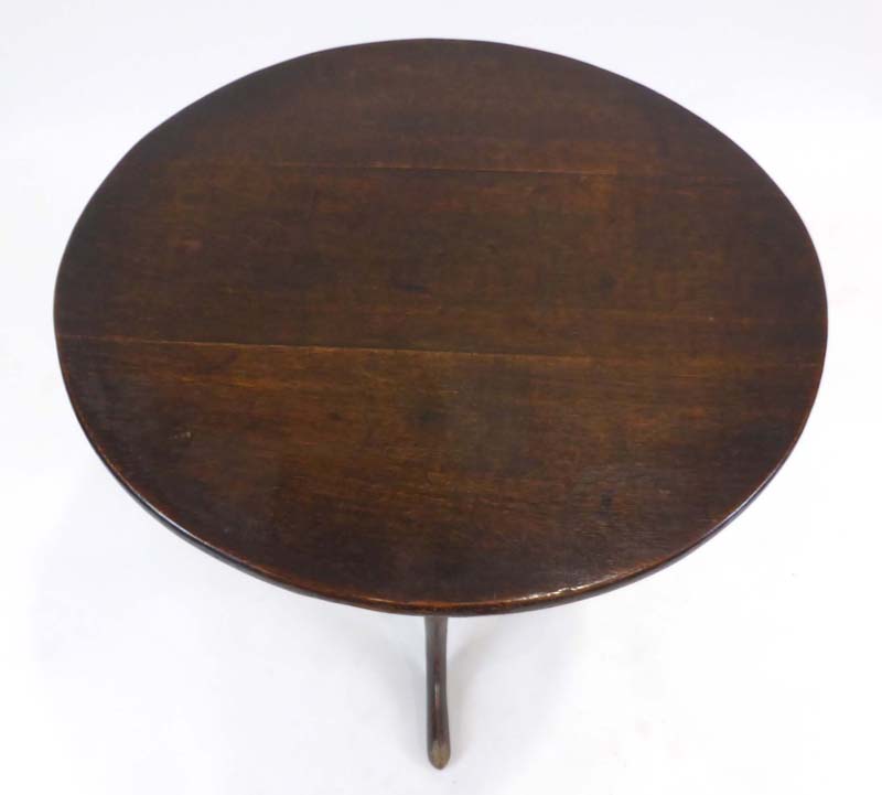 An 18th century oak tilt-top table, the circular top on a turned column, - Image 2 of 2