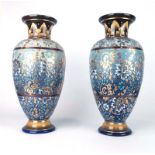 A pair of Royal Doulton vases of baluster form decorated in the 'lace' pattern with stylised