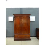 A Victorian mahogany linen press, the two doors over a single drawer on a plinth base, w.