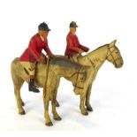 A pair of carved and painted wooden figures, each modelled as a mounted huntsman, max h.