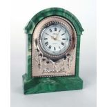 A modern silver mounted bedside timepiece in a faux malachite case of architectural form, Carrs,