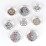 A group of eight silver proof collectable coins including a DNA Double Helix two pound coin and