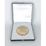 A cased replica oversized 1933 twenty dollar Double Eagle coin