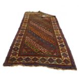 A Caucasian Kazak rug decorated with rows of red, blue,