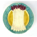 A 19th century majolica serving plate relief decorated with stylised asparagus, d.