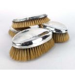 Two pairs of early 20th century silver backed oval brushes,