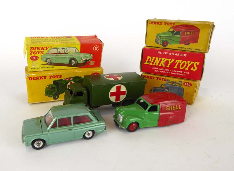 Four Dinky Toys models comprising: 295 Atlas bus, 470 Austin van 'Shell',
