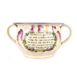 A Sunderland lustre two handled novelty chamber pot internally decorated with a frog and reading