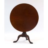 A Georgian tilt-top table, the circular mahogany top on a birdcage mechanism,