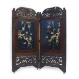 A late 19th/early 20th century Japanese carved and lacquer work two section screen relief decorated