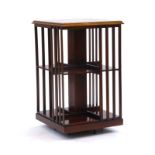 A 20th century mahogany, satinwood and ebony strung revolving bookcase, h.