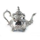 A silver teapot,