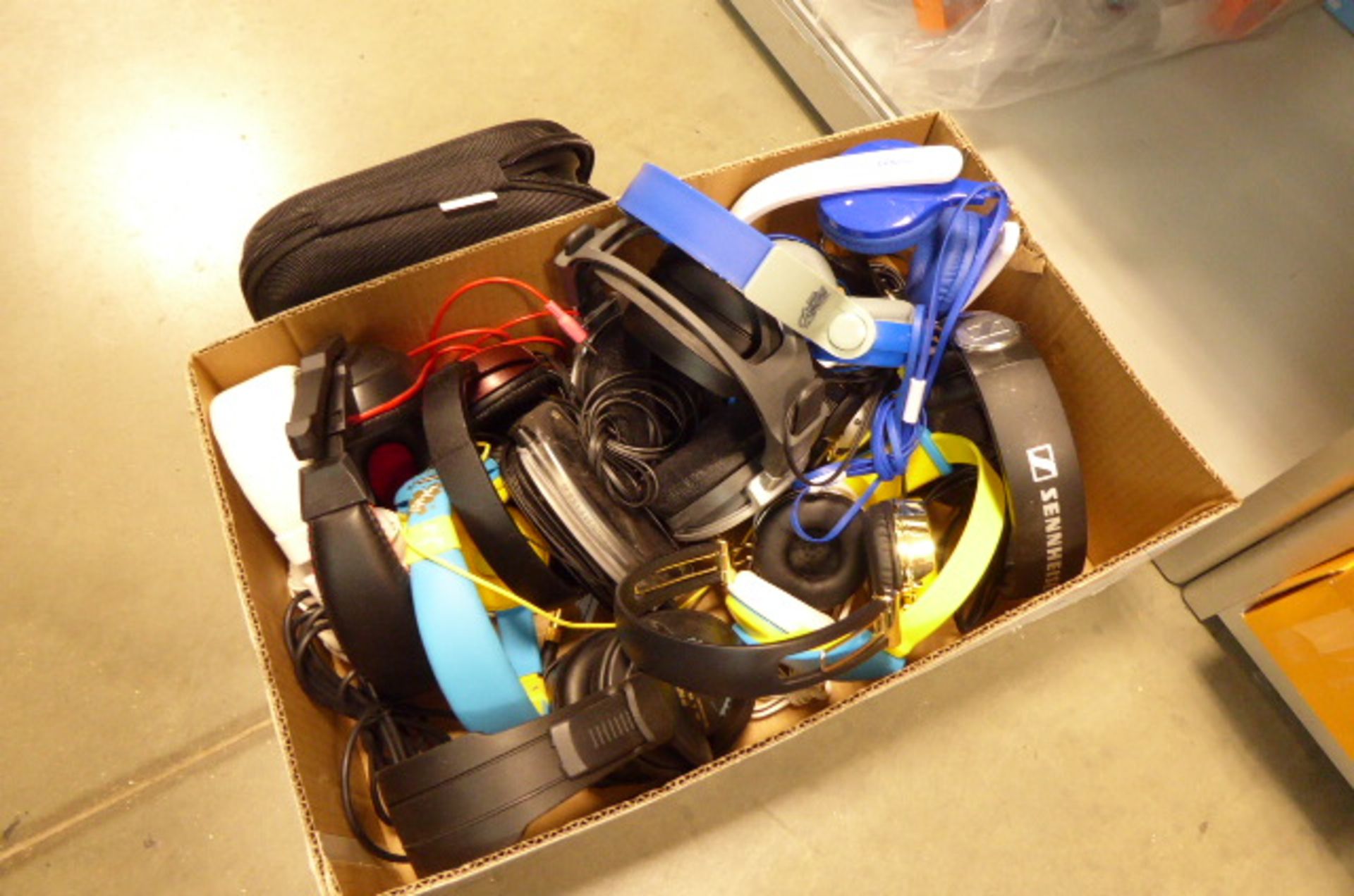 Cardboard tray of mixed headphones