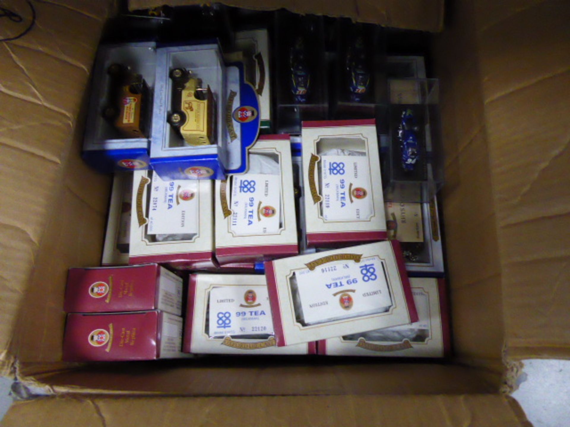 box of mixed die-cast vehicles including commercial, and motorbikes.