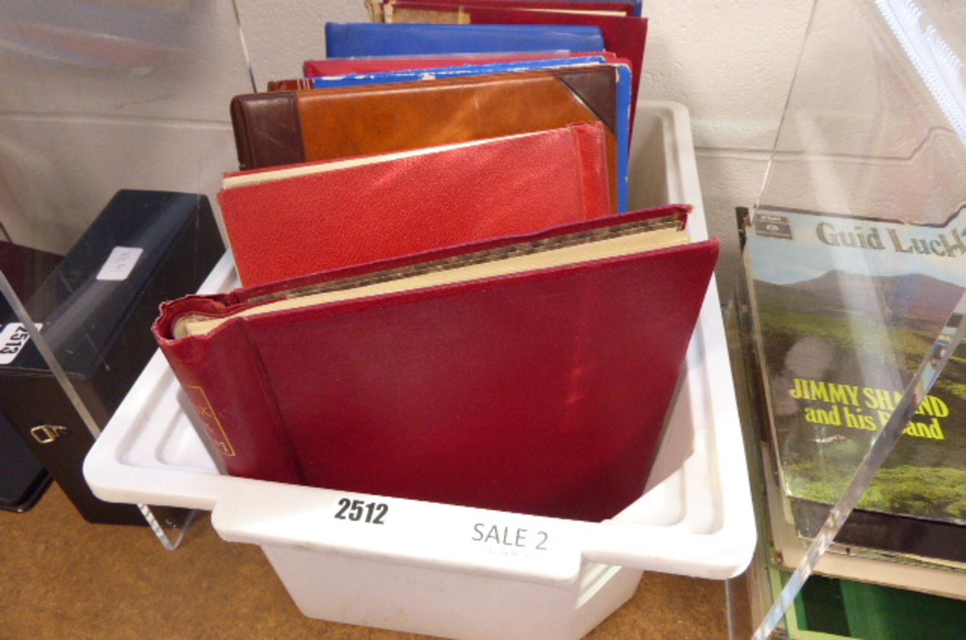 Large plastic crate of various stamp binders to inc. contents