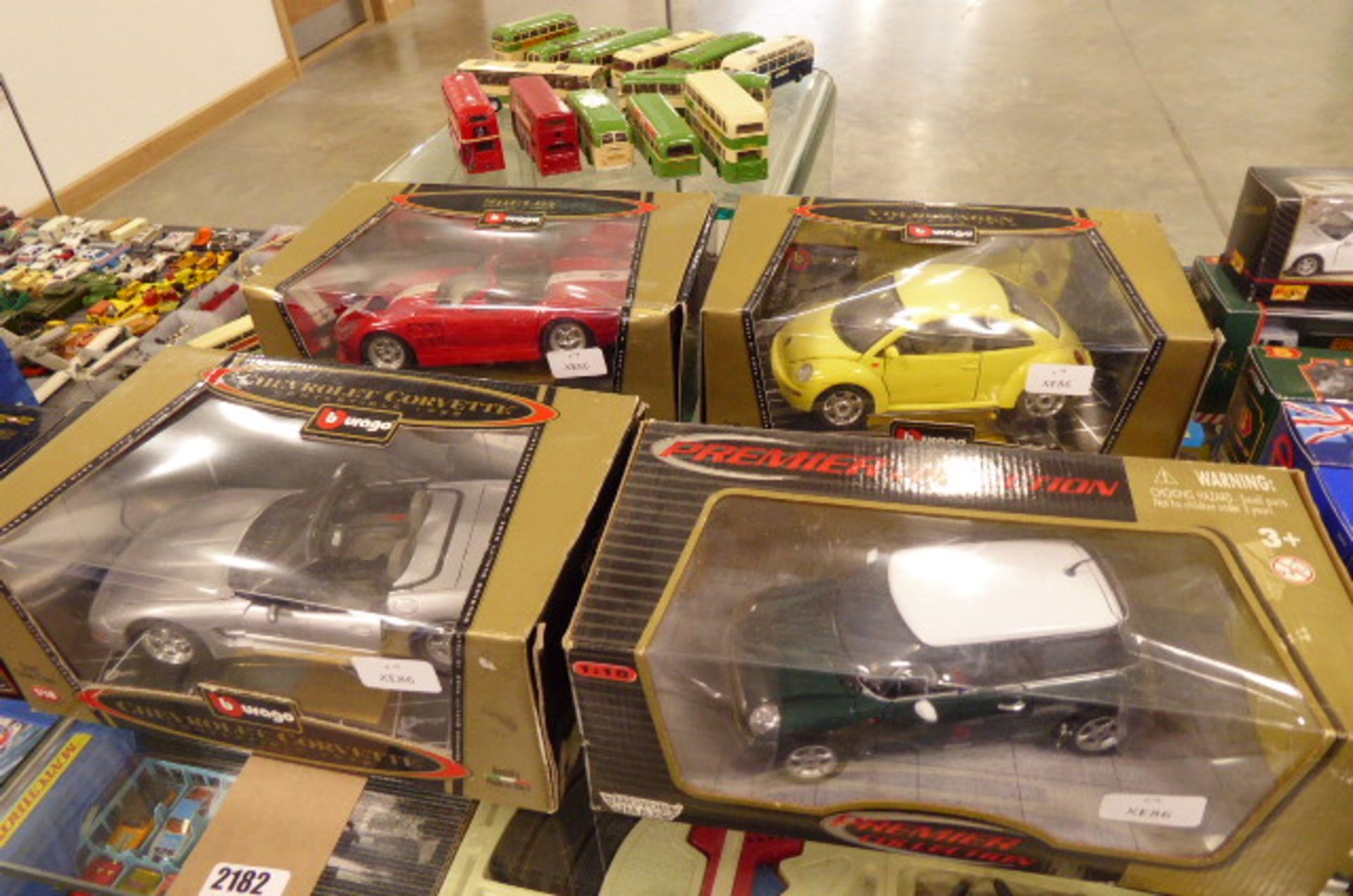 4 die cast model vehicles in boxes including Chevolet Corvette 1998 and Shelby series 1 1999