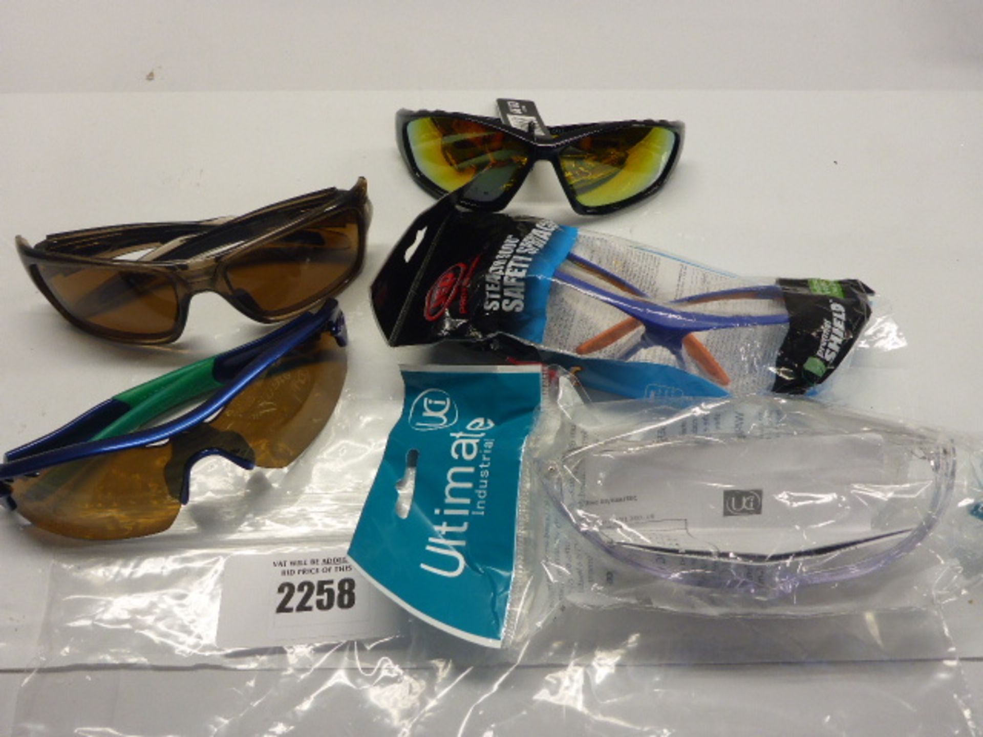 Three pairs of protective eyewear, and Two pairs of Oakley sunglasses.