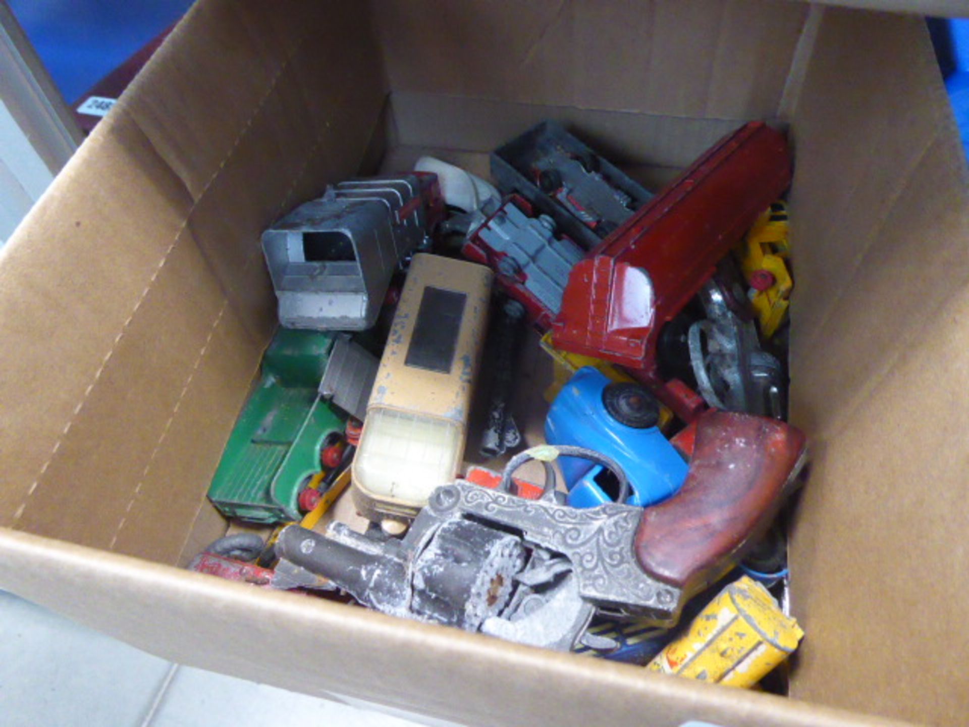 Collection of loose vintage die cast toys in box