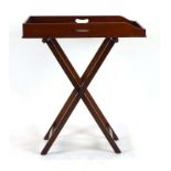 A 19th century mahogany butler's tray on a folding stand, w.