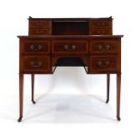 An Edwardian mahogany and crossbanded ladies writing table,