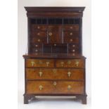 A George I and later cabinet-on-chest,