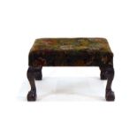 A reproduction footstool,