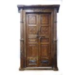 An Indian double door and frame with cast metal bolt and hinges,