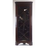 An 18th century-type mahogany corner cabinet,