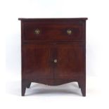 A Georgian and later converted mahogany cabinet, the lift lid over a pair of doors, on splayed feet,