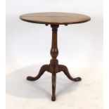 A Georgian mahogany occasional table, the circular tilt-top on a turned column and tripod base, d.