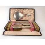 An early 20th century five piece silver mounted and engine turned dressing table set in the