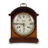 A Comitti of London mantle clock, the movement striking on a bell,