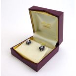 A pair of 18ct white gold ear studs,