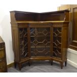 An Edwardian mahogany and glazed corner bookcase, w.