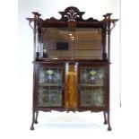 A late 19th/early 20th century mahogany sideboard decorated with Art Nouveau scrolls and marquetry,