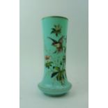 A late 19th/early 20th century pale blue glass vase of slightly flared form hand painted with a