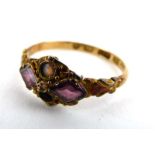 A 19th century 15ct yellow gold ring set opal and amethyst in a diamond shaped scrollwork setting,