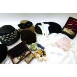 A group of vintage French hats, a leather cased sewing set with bone fitments, a mask,