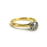 An 18ct yellow gold ring set brilliant cut diamond in an eight claw setting,