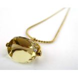 A gold plated s-link necklace suspending a 9ct yellow gold swivel fob set citrine, fob w. 2.